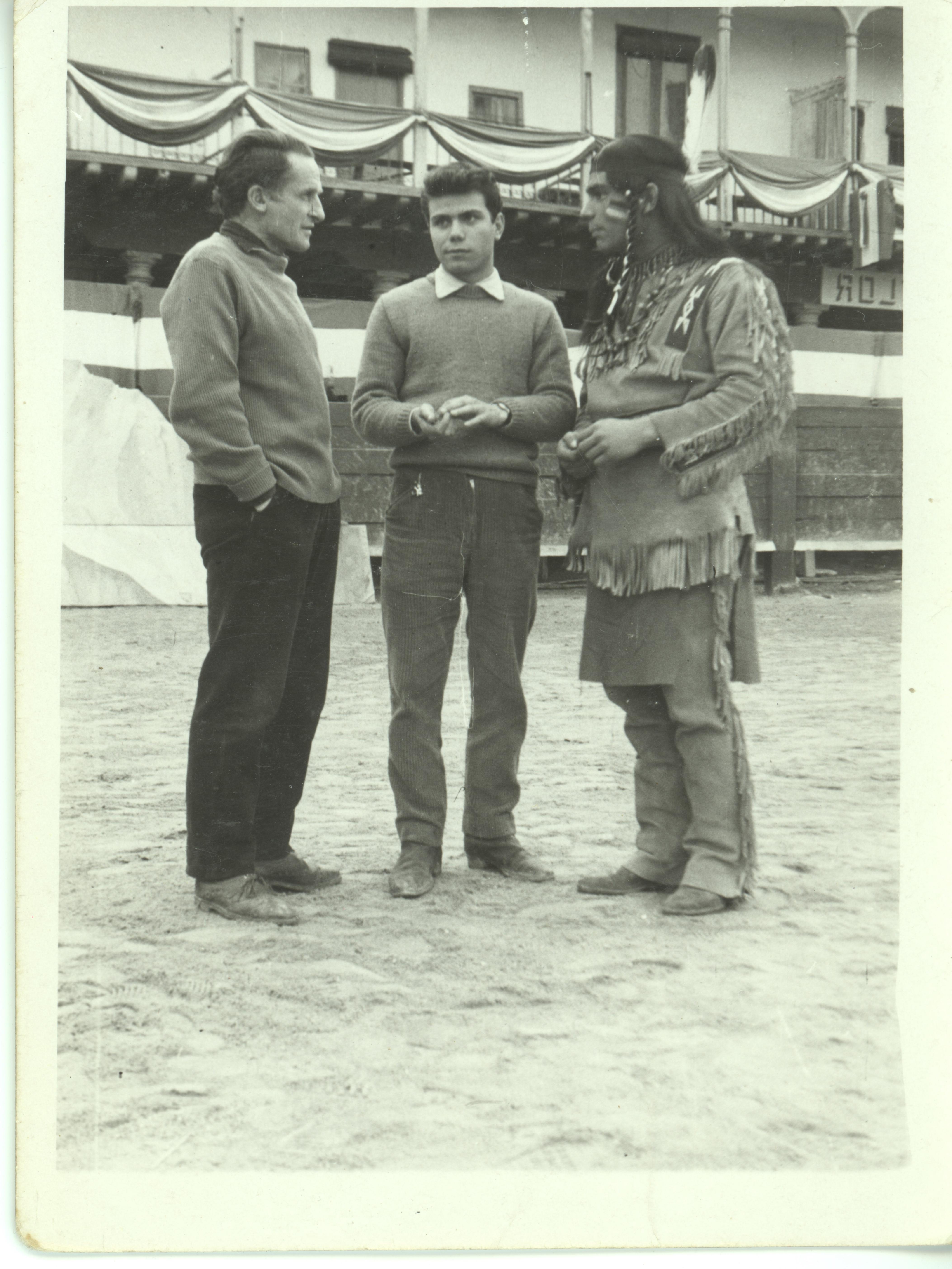 Assistant producer Francisco Rodríguez in the middle, with Enrique Santiago García (“El Cacharra”) on his right.  Movie: Circus World, 1964. Dir. Henry Hathaway, with John Wayne and Rita Hayworth Claudia Cardinale. Location: Main Square of Chinchón, Madrid.